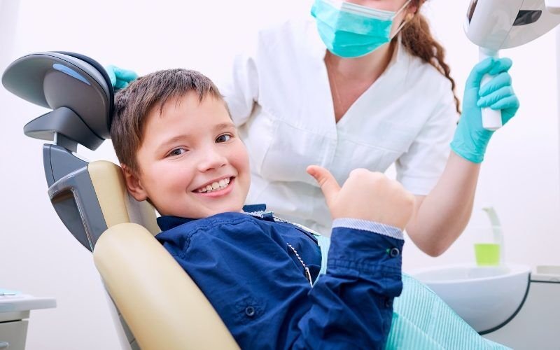 Young boy smiles after dental treatment. Medazur Medical Clinic in Leytonstone.